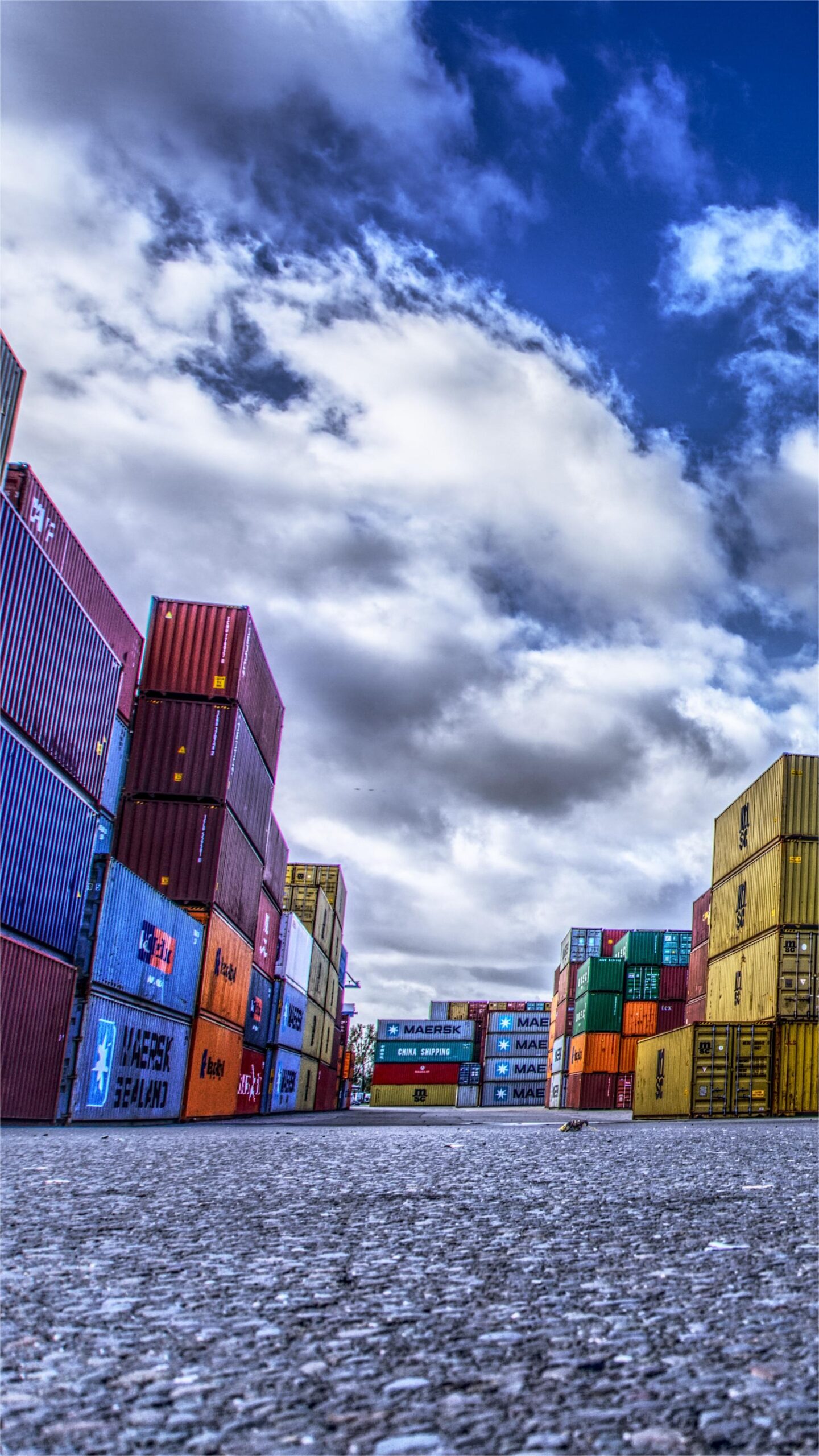 Full container load cargo being loaded at a Chinese port for shipping to the USA