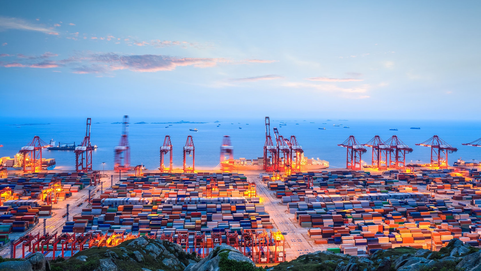 Cargo ship at a busy Chinese port representing global logistics